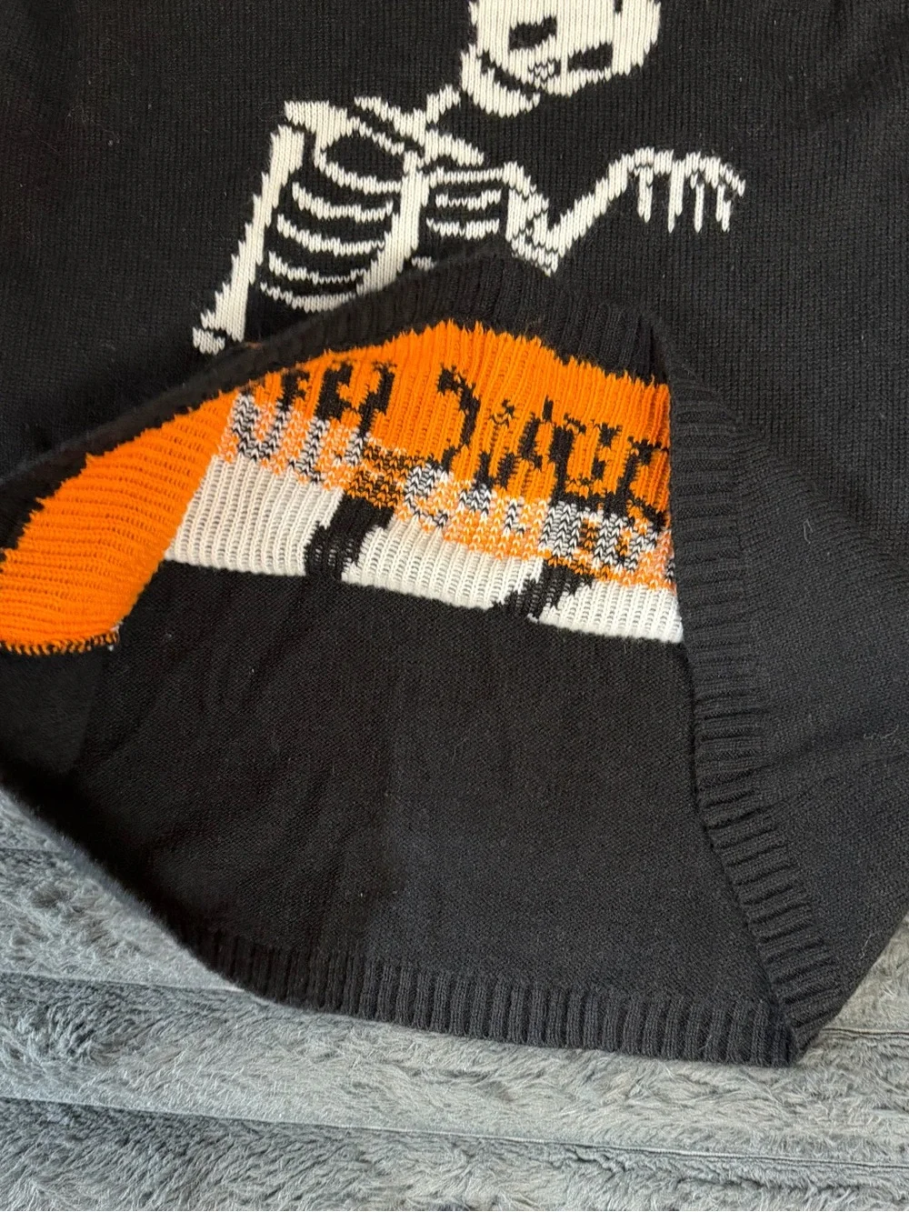 Black & White Skeletal Graphic Crewneck Sweater with Orange Accent
